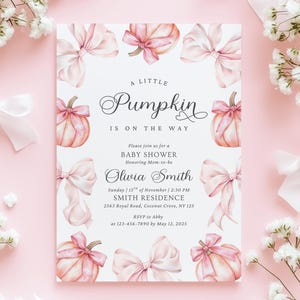 May include: A rectangular baby shower invitation card featuring a white background with illustrations of light pink pumpkins and bows. The text reads: A LITTLE Pumpkin IS ON THE WAY, Please join us for a BABY SHOWER Honoring Mom-to-be Olivia Smith.