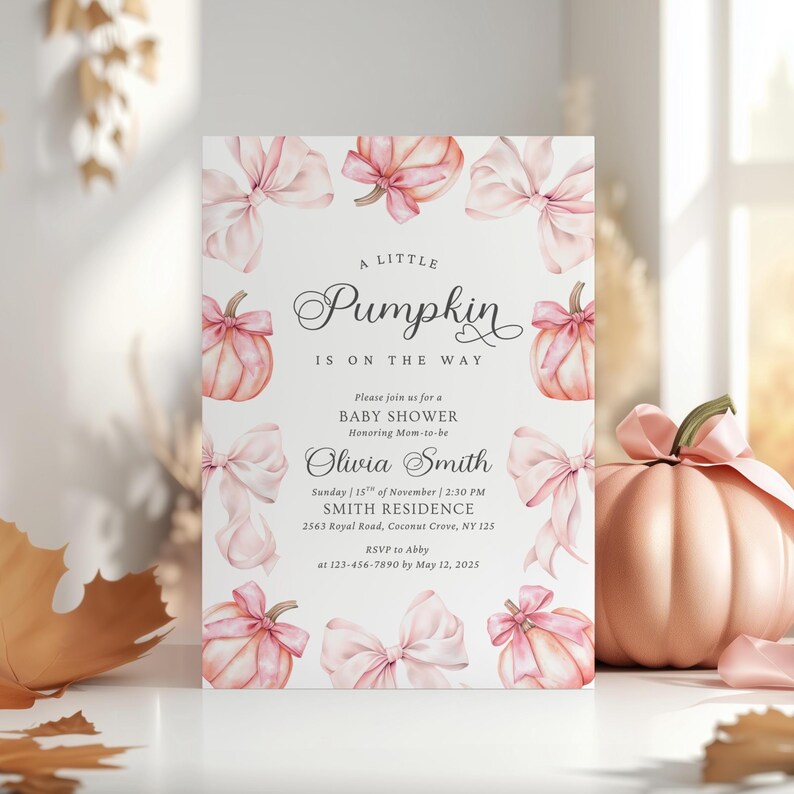 May include: A rectangular baby shower invitation card featuring a white background with watercolor illustrations of light pink pumpkins and bows. The text reads: A little Pumpkin is on the way, Please join us for a BABY SHOWER, Olivia Smith, Sunday, 15th of November, 2:30 PM, SMITH RESIDENCE, 2563 Royal Road, Coconut Grove, NY 125, RSVP to Abby at 123-456-7890 by May 12, 2025.