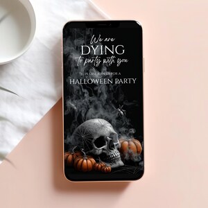 May include: A smartphone displays a Halloween party invitation. The black background features a skull, pumpkins, and spiderwebs. Text reads, "We are dying to party with you. Please join us for a Halloween party."