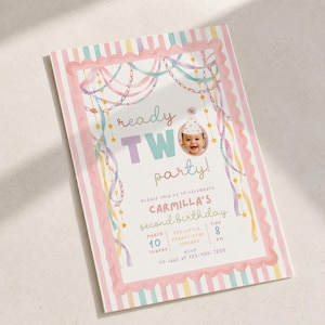 May include: A rectangular birthday invitation card featuring a pastel striped border and scalloped pink frame. The text reads ready TWO party, Carmilla's second birthday, March 10, 123 Little Peanut Road, Chicago, 8 PM, RSVP to Jane at 123-456-7890.