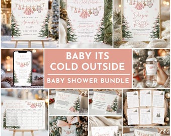 Puede incluir: Un conjunto para baby shower con temática invernal. El diseño presenta elementos rosas y blancos, incluyendo ropa de bebé colgada en una cuerda, copos de nieve y árboles de Navidad. El texto "Baby It's Cold Outside" se muestra de forma destacada.