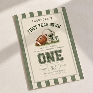 May include: A rectangular invitation card with a cream center and dark green striped borders. It features a brown football and a white helmet illustration, with the text: THEODORE'S FIRST YEAR DOWN, ONE, SATURDAY SEPT 3RD 2:00 PM, 123 ANYWHERE STREETCITY 45321, RSVP: SARAH 123-555-8789.