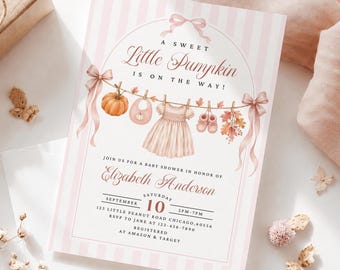 May include: A baby shower invitation card with light pink vertical stripes, featuring a clothesline illustration with a pumpkin, bib, dress, and booties. Text reads: A SWEET Little Pumpkin IS ON THE WAY! JOIN US FOR A BABY SHOWER IN HONOR OF Elizabeth Anderson SATURDAY SEPTEMBER 10 2PM-7PM 123 LITTLE PEANUT ROAD CHICAGO, 60556 RSVP TO JANE AT 123-456-7890 REGISTERED AT AMAZON & TARGET.