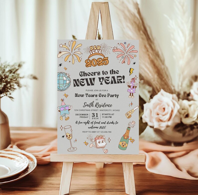 May include: A New Year's Eve party invitation on a small wooden easel. The invitation features the text "Cheers to the NEW YEAR!" with the year 2025, fireworks, and other festive illustrations. The invitation includes the date, time, and location.