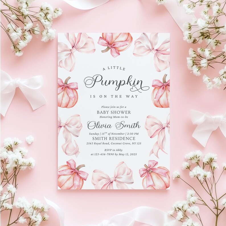 May include: A rectangular baby shower invitation card featuring a white background with illustrations of light pink pumpkins and bows. The text reads: A LITTLE Pumpkin IS ON THE WAY, Please join us for a BABY SHOWER Honoring Mom-to-be Olivia Smith.