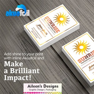 May include: A white business card with a gold border and a gold sun graphic. The text "Sunrise Professional Consultant Est. 1970" is printed in black. The text "John Smith Project Manager" is printed in gold. The text "info@sunrisepcon.com www.sunrisepcon.com 888.555.0100" is printed in gold.