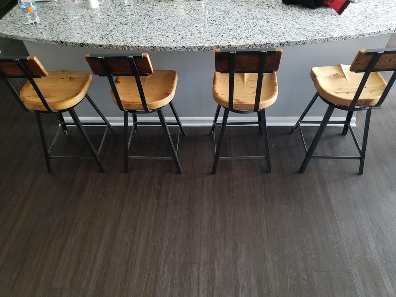 Comfortable Kitchen Seating Industrial Bar Stool Scooped Seat Design Swivel Function Feature Counter Height Chair Back Support Construction Reclaimed Wood Material Farmhouse Style Appearance Modern Home Decor Kitchen Island Seating Solution