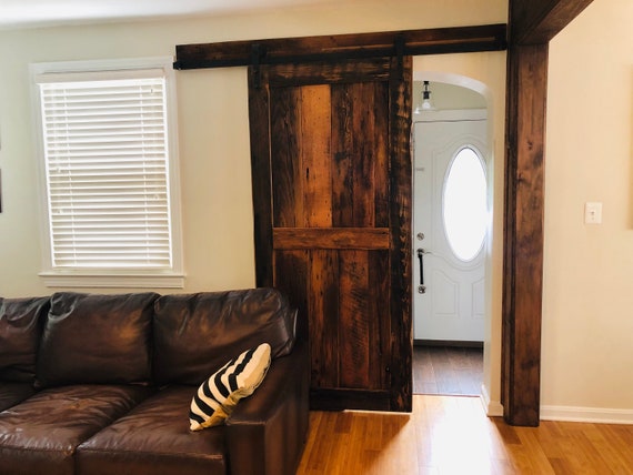 Sliding Barn Door From Reclaimed Wood And Vintage Hardware