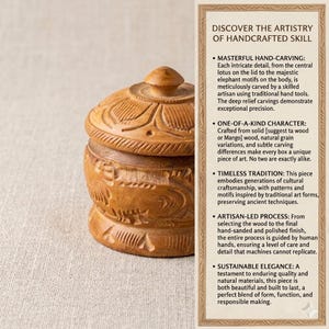 May include: A handcrafted wooden box with a lid, showcasing intricate carvings. The box is brown with detailed patterns, including floral and elephant motifs. The text in the image says "DISCOVER THE ARTISTRY OF HANDCRAFTED SKILL".