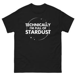 May include: Black t-shirt with the text "TECHNICALLY I'M FULL OF STARDUST" in white, inside a white circle with star accents. The shirt is a short-sleeved, crew neck style.