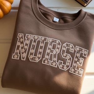 Floral Embroidered Nurse Sweatshirt, Toile RN Shirt
