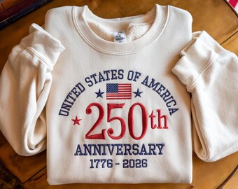 Sudadera del 250 aniversario de EE. UU., con diseño de la bandera estadounidense bordada.