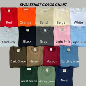 May include: A colour chart displaying fifteen crewneck sweatshirts in various shades including red, orange, sand, beige, white, sport grey, black, grey, light pink, light blue, dark choco, brown, maroon, caroline blue, forest green, military green, and navy.