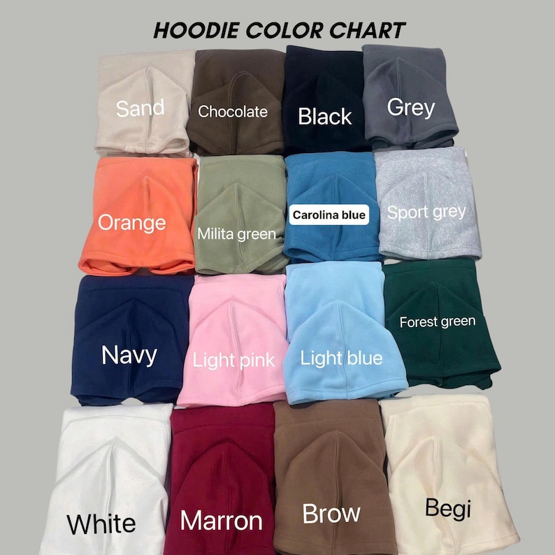 May include: A hoodie colour chart displaying sixteen folded hooded sweatshirts in various colours including sand, chocolate, black, grey, orange, military green, Carolina blue, sport grey, navy, light pink, light blue, forest green, white, maroon, brown, and beige.