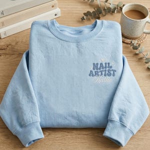 May include: A rustic wooden sign with the text "Welcome to our home" in white lettering. The sign features a distressed finish and a simple, inviting design, perfect for a front porch or entryway.