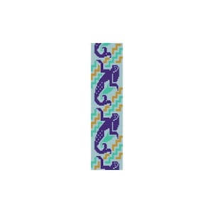 May include: A beaded bracelet with a repeating pattern of purple lizards on a light blue background with green and gold accents.