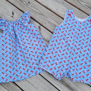 Jongensmeisjes tweeling kreeftoutfits, jurk met fladdermouwen en Jon Jon, langoesten