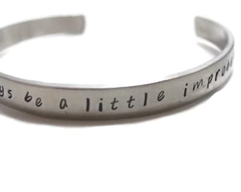 One Should Always Be A Little Improbable Customizable Hand Stamped Metal Cuff Bracelet