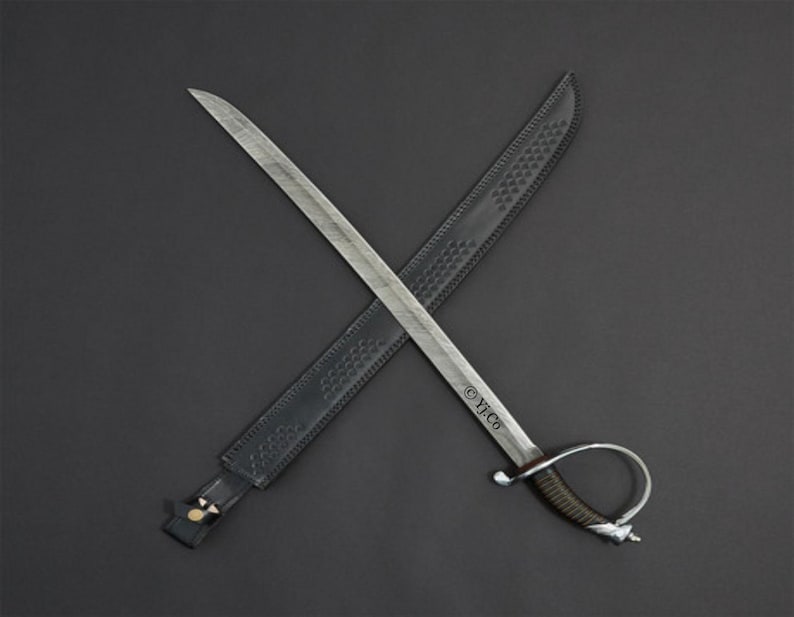 May include: A silver-bladed sword with a curved handle and a black leather sheath, set against a dark gray background. The sword is crossed over the sheath. The handle has a dark brown grip.