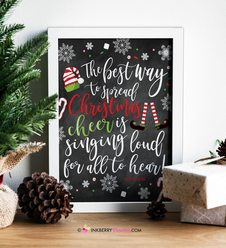 May include: A black chalkboard with white lettering that reads "The best way to spread Christmas cheer is singing loud for all to hear!" with a red and white candy cane, snowflakes, and two elves with red and white striped stockings on a white background.