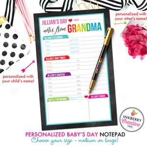 May include: A personalized baby's day notepad with the text "Jillian's Day notes from Grandma." The notepad includes sections for feedings, nap times, diapers, notes for mommy, and mood. A gold pen rests on the notepad. The notepad is black with a white interior.