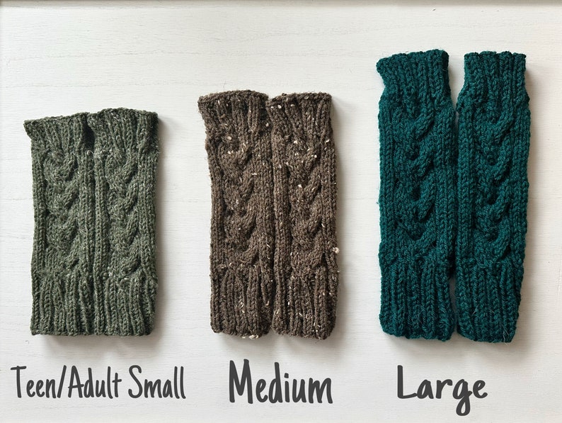 May include: Three pairs of knitted arm warmers in different sizes: teen/adult small, medium, and large. The arm warmers are green, brown, and teal.
