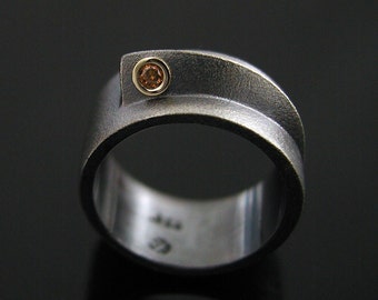 Modern ring with bezel set cognac diamond in 18K gold and oxidized, textured, hammered silver