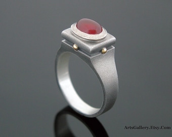 Ring with carnelian cabochon stone bezel set in oxidized, textured, hammered silver and 18K gold