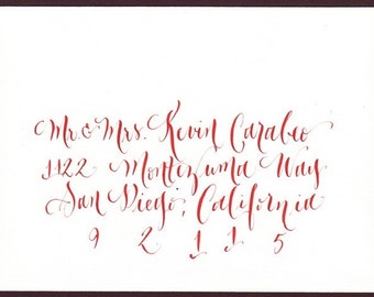 Hand addessing wedding envelopes modern calligraphy