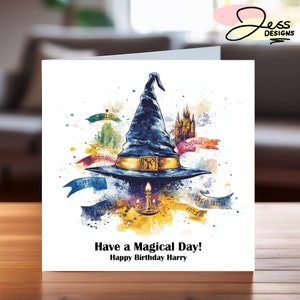 May include: A watercolour illustration of a wizard's hat with a golden band and a candle in front of it. The hat is surrounded by colourful watercolour splatters and text that says "Have a Magical Day! Happy Birthday Harry".