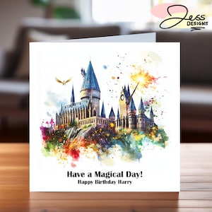 May include: A watercolour illustration of Hogwarts castle with a golden snitch flying overhead and a wand casting a spell. The text reads "Have a Magical Day! Happy Birthday Harry".