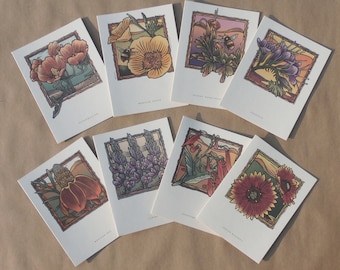 May include: Set of eight illustrated greeting cards featuring various flowers and insects. The cards are white with a brown border and feature a variety of flowers, including Indian Blanket, Mexican Poppy, and Desert Agave. Each card has a different flower and insect, and the names of the flowers are printed on the bottom of each card.