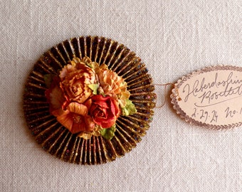 Red apricot pink almond handcrafted millinery flowers gold glittered metallic rosette ornament