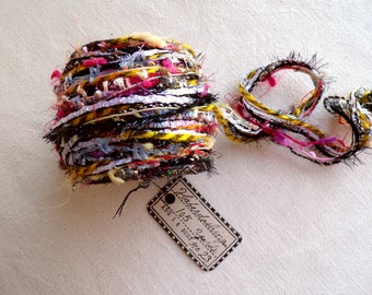 Carnival Spool no. 23 - black yellow pink blue pearl mix tinsel tassel yarn trim