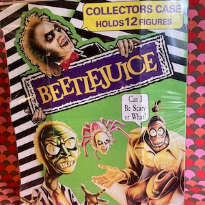May include: A black and white striped background with a green border. The image features a character from the movie Beetlejuice, with the words "Beetlejuice" in purple and gold letters. The text "Collectors Case Holds 12 Figures" is in green letters. The image also features a green monster, a spider, and a man with a hat.