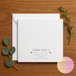 May include: White card with the text "CARDS 4 YOU 2" and "WHERE EVERY CARD TELLS A STORY" in black text. The text is centered on the card and is surrounded by two small hearts.