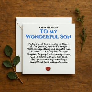 May include: A white card with a blue and red heart design. The card reads "Happy Birthday To My Wonderful Son" and includes a poem about a son's courage and strength.