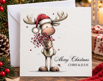 May include: A square greeting card featuring a whimsical illustration of a reindeer wearing a red Santa hat and holding a bouquet of red berries. The text Merry Christmas and CHRIS & JULIE is printed in black script and block lettering on the card.