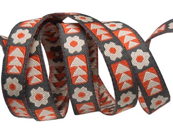 A single 2.5 yard cut of woven jacquard ribbon, 3/8" wide, flowers and arrows, white and orange on grey background.