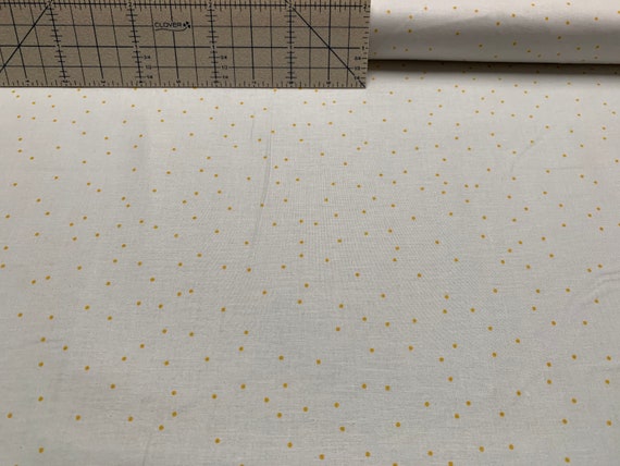 100 percent cotton fabric honey dots on white. Quantity 1= fat quarter. Greater than 1 is a continuous cut.