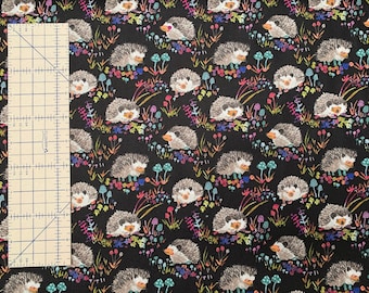 Light canvas weight, 100 percent cotton fabric, adorable hedgehogs on black background. Price is per Fat Quarter.