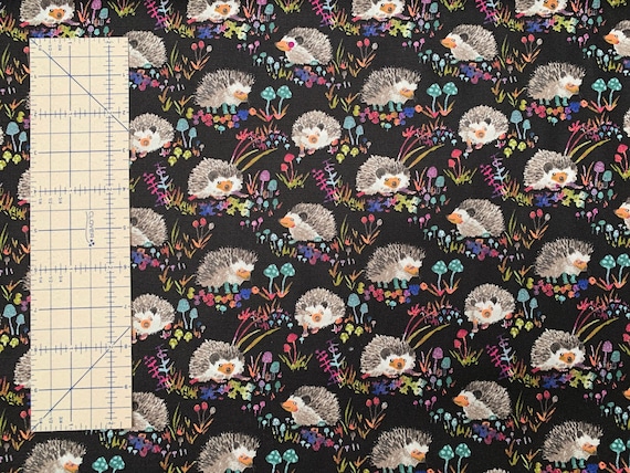 Light canvas weight, 100 percent cotton fabric, adorable hedgehogs on black background. Price is per Fat Quarter.