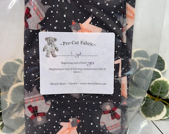 A 1-yard precut of 100 percent cotton fabric, holiday theme, bears on grey.
