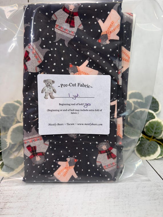 A 1-yard precut of 100 percent cotton fabric, holiday theme, bears on grey.
