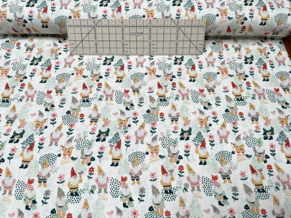 100 percent cotton fabric gnomes on cream background. Quantity 1= fat quarter. Greater than 1 is a continuous cut.