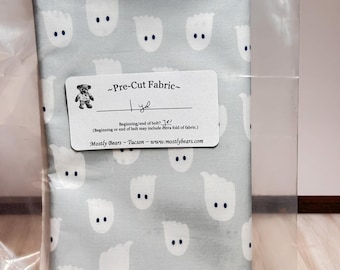 A 1-yard precut of 100 percent cotton fabric Halloween ghosts, white on light grey.