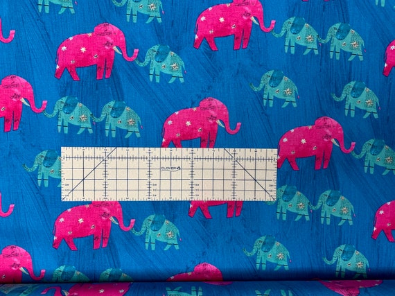 100 percent cotton fabric pink/green elephants on blue background. Quantity 1= fat quarter. Greater than 1 is a continuous cut.