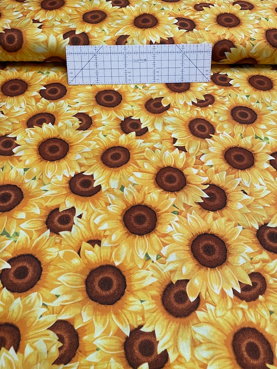 100 percent cotton fabric sunflowers all over. Quantity 1= fat quarter. Greater than 1 is a continuous cut.