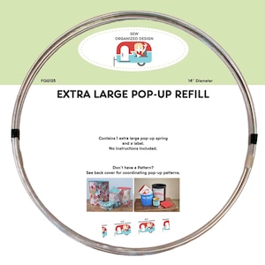 May include: A silver metal Extra Large Pop-Up Refill ring, 35.56 cm in diameter. The product includes a spring and a label. The packaging features the text "SEW ORGANIZED DESIGN" and "EXTRA LARGE POP-UP REFILL".