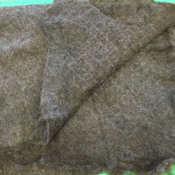 A 36 x 42" piece of 100% alpaca thick felt batting, machine felted in cottage spinnery, many uses!